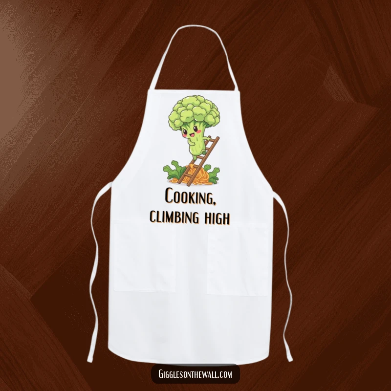 Funny apron with a determined broccoli floret climbing a noodle ladder, perfect for cooking with a healthy focus.