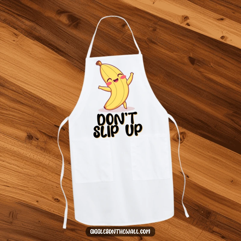 Funny apron featuring a laughing banana peel comically tripping, ideal for kitchen use and adding humor to cooking.