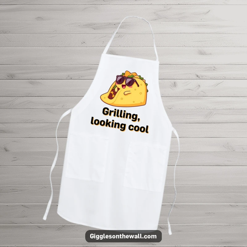 Funny lounging taco apron graphic of a cool taco character in sunglasses, casually lounging on a giant chip.