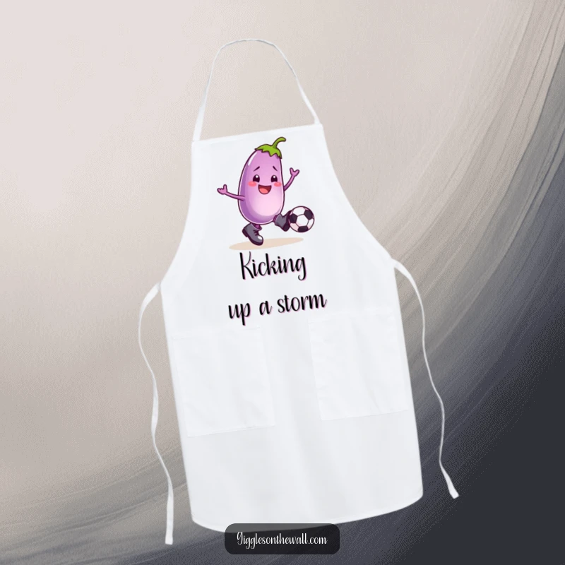 Funny apron featuring a smiling eggplant in boots, enthusiastically kicking a football, designed for kitchen fun and flair.