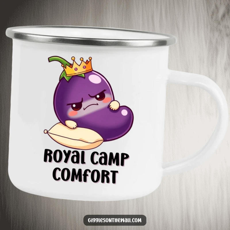 Funny grumpy eggplant camping mug wearing a crown, carried on a plush pillow, rugged and humorous outdoor drinkware.