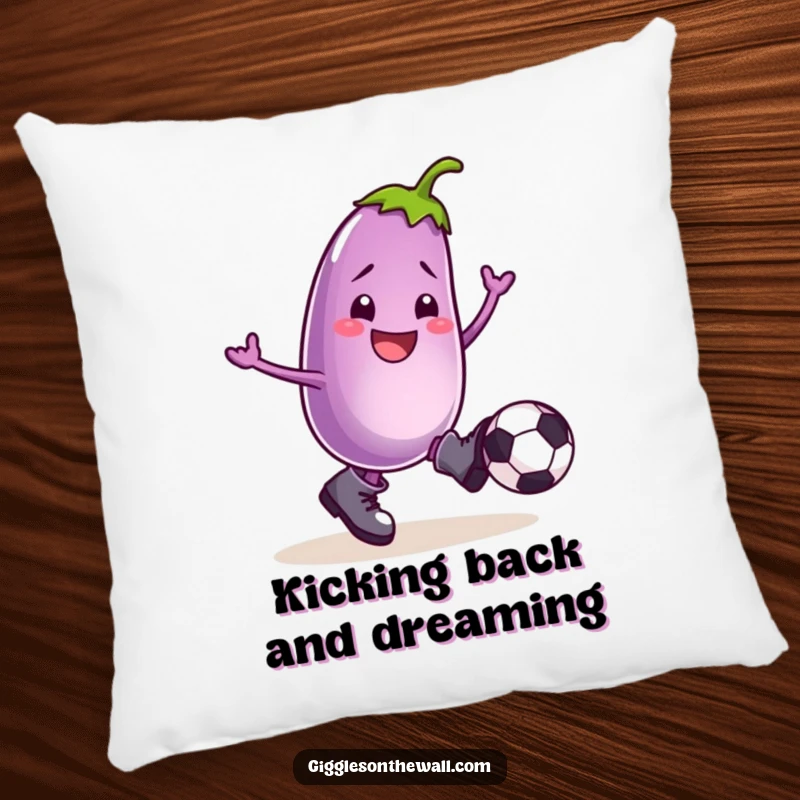Funny pillow with a smiling eggplant in boots, kicking a football, providing comedic comfort and playful decor.