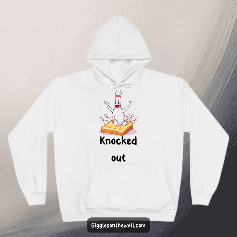 Funny bowling pin hoodie depicting a sentient juggler hilariously dropping pins onto surprised toast, offering warmth and humor.