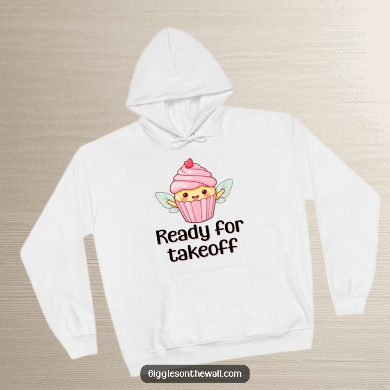 Funny hoodie depicting a happy cupcake with candy wings, soaring towards freedom with a touch of sugary charm.