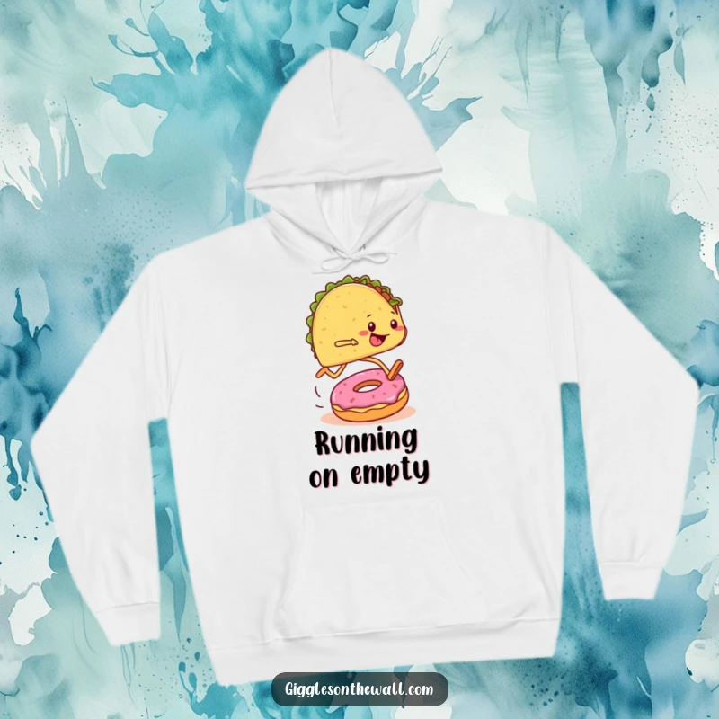 Funny hoodie featuring a taco with legs running a marathon and hilariously tripping over a donut, offering warmth and humor.