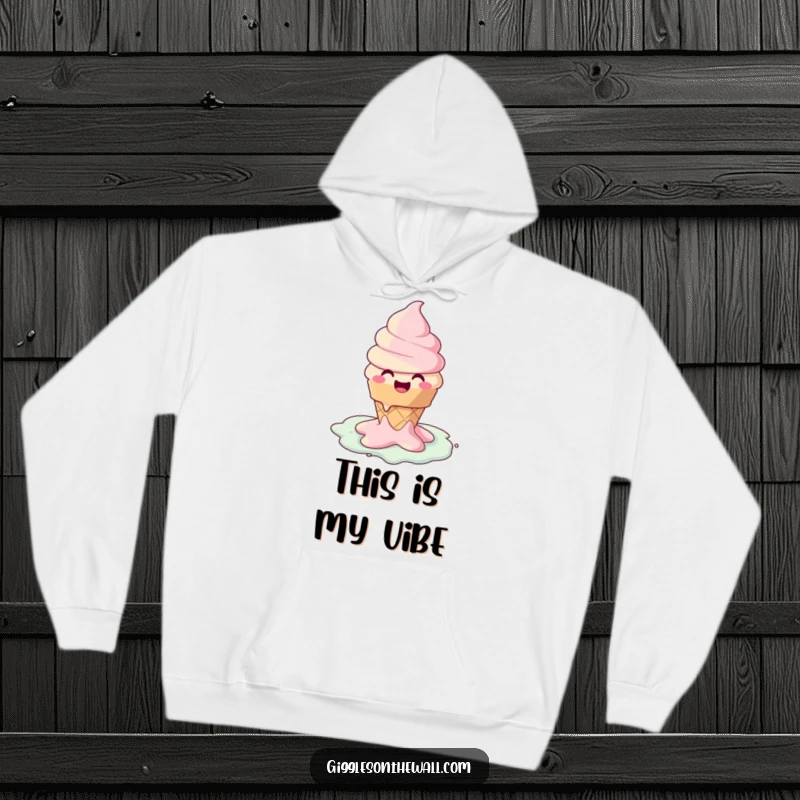 Funny hoodie showcasing a happy ice cream cone character melting into a joyful puddle, perfect for cozy, humorous moments.