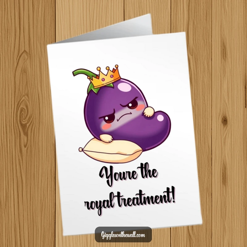 Funny Free Printable Birthday Card: A grumpy eggplant wearing a tiny crown is carried regally on a plush pillow, looking unimpressed.