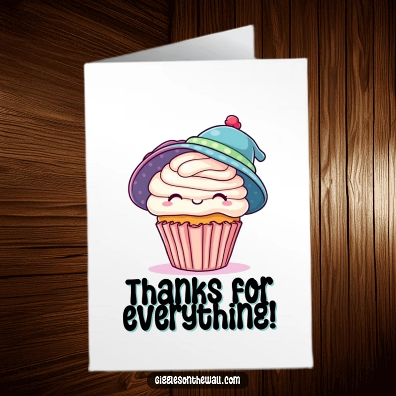 Funny Free Printable Thank You Card: A cheerful cupcake attempting to don two hats, expressing thanks.