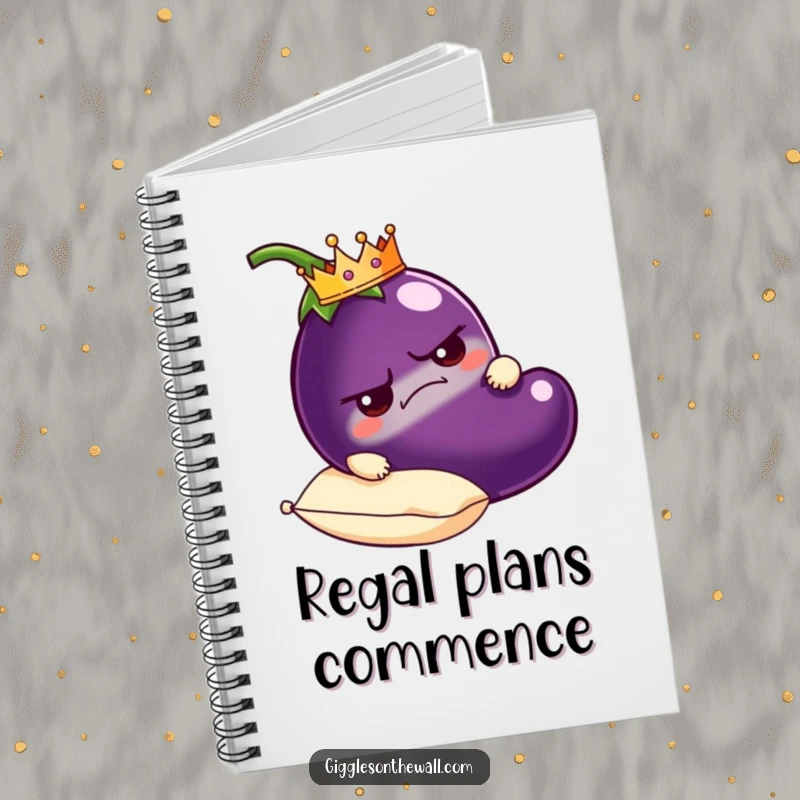 Funny grumpy eggplant notebook wearing a crown, carried on a plush pillow, humorous stationery for royal thoughts.