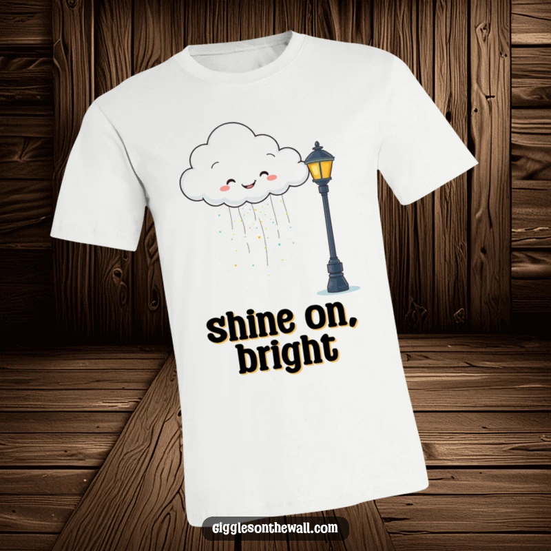 Funny t-shirt featuring a happy cloud raining glitter onto a grumpy lamppost, perfect for spreading cheer.